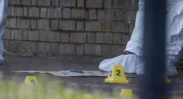 Police officers remain at the scene of a serious stabbing incident on Kinnaird Avenue in north Belfast.