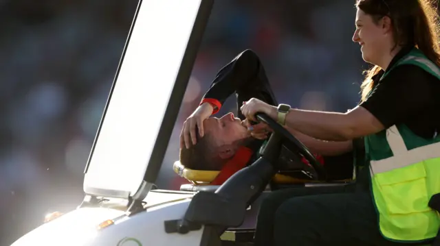 Sol Budinger is driven off on a stretcher