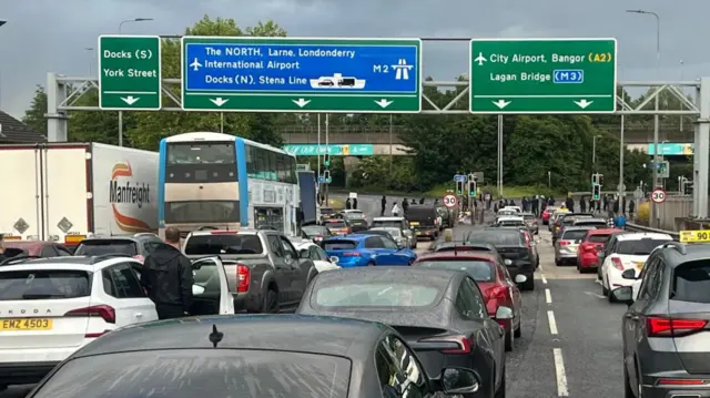 cars queuing up to get onto motorway