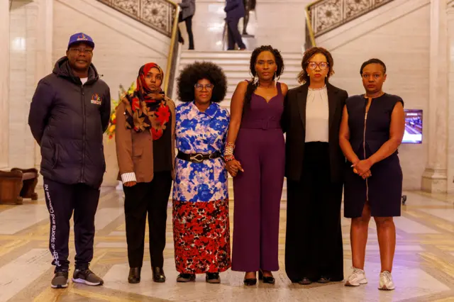Jahswill Emmanuel (left) alongside other members of ethnic minority communities at Stormont