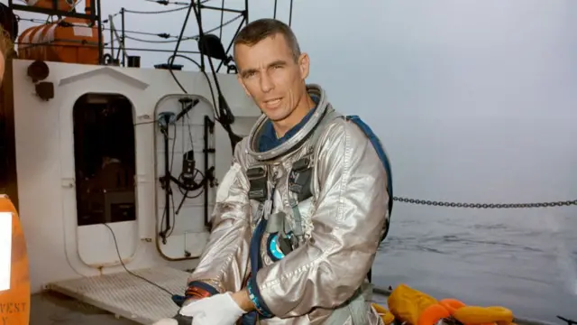 Gene Cernan standing on deck of the NASA Motor Vessel Retriever