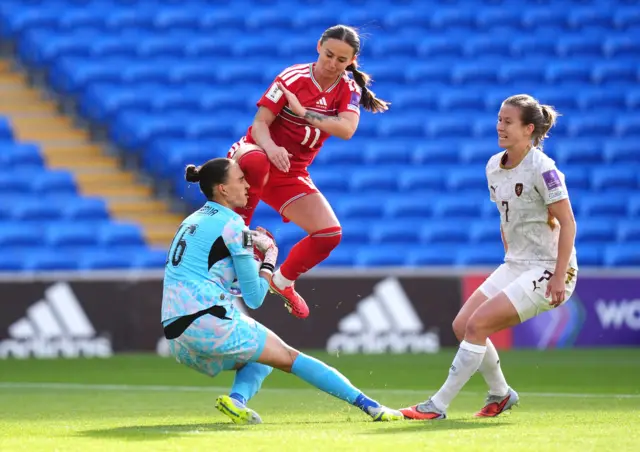 Wales' Hannah Cain (centre) attempts to claim the ball but collides into Czech Republic goalkeeper Olivie Lukasova