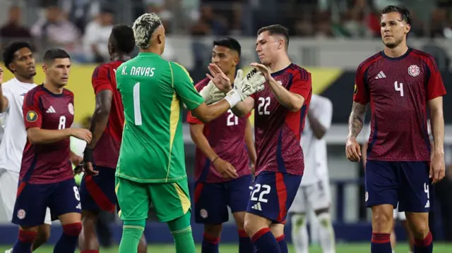 : Costa Rica forward Carlos Mora (22) and Costa Rica goalkeeper Keylor Navas (captain) (1) high five each other