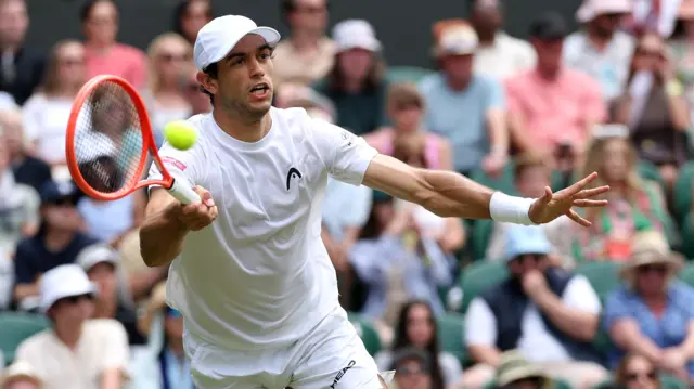 Nuno Borges hits a forehand