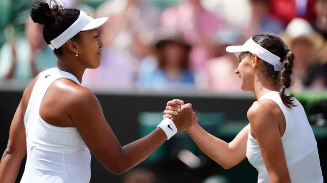 Naomi Osaka shakes hands with Anastasia Gasanova