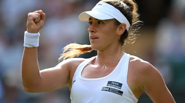 Solana Sierra celebrates with a clenched fist