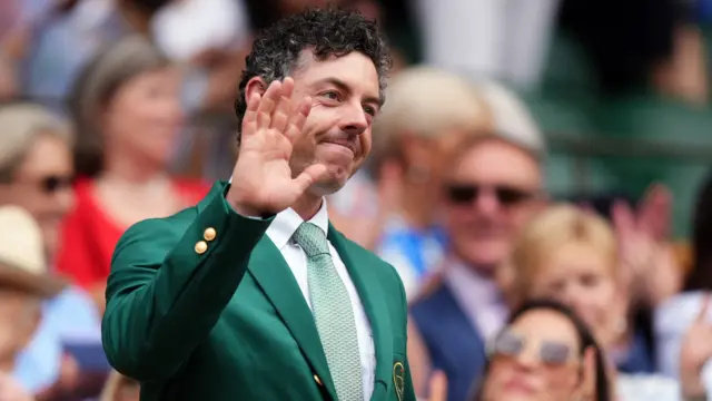 Rory McIlroy waves to the crowd on Centre Court