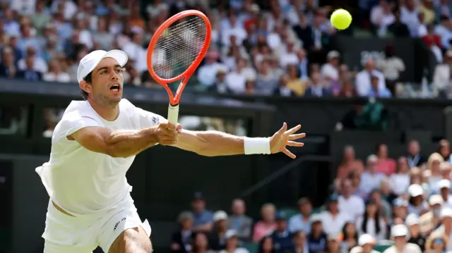 Nuno Borges hits a forehand