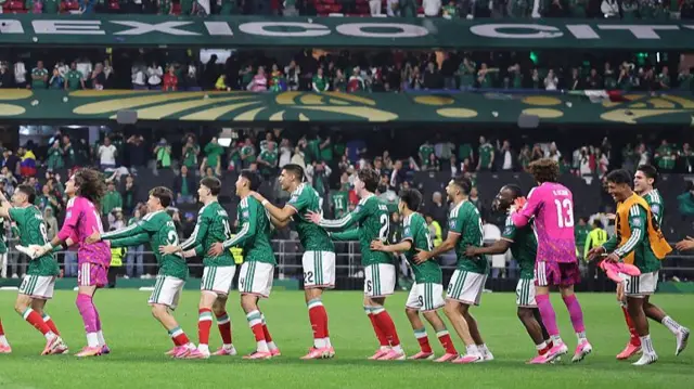 Mexico players do the conga at the Azteca after beating Ecuador