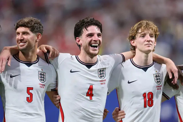 John Stones, Declan Rice and Anthony Gordon of England celebrate