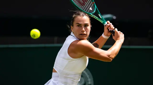 Aryna Sabalenka hits a backhand
