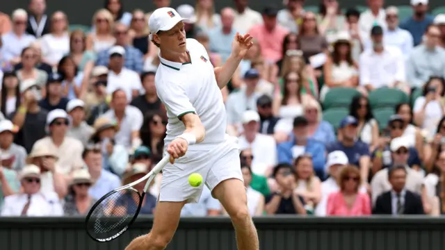 Jannik Sinner hits a forehand