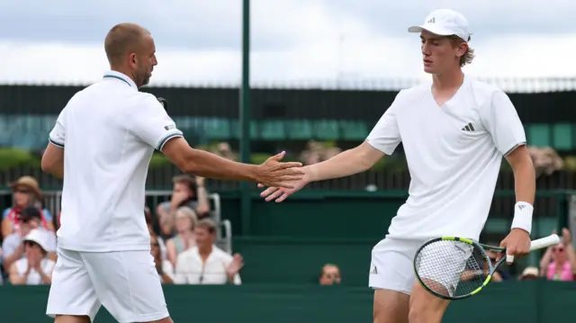 Dan Evans high-fives Henry Searle