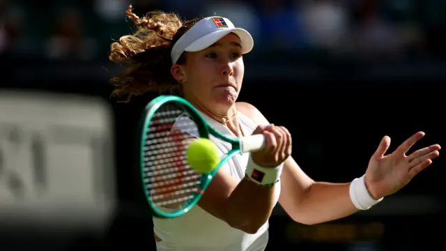 Mirra Andreeva hits a forehand