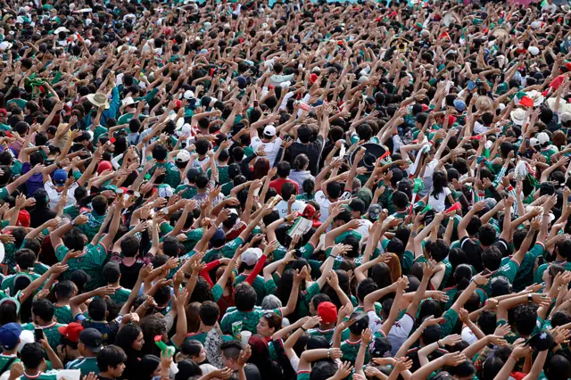 Mexico fans raise their hands in Guadalajara