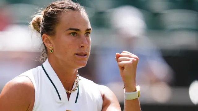 Aryna Sabalenka celebrates with a clenched fist
