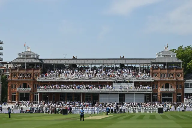 England and India players line up for the national anthems in front of the Lord's pavillion