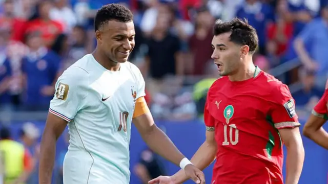Kylian Mbappe smiles next to Morocco's Brahim Diaz - a Real Madrid team-mate