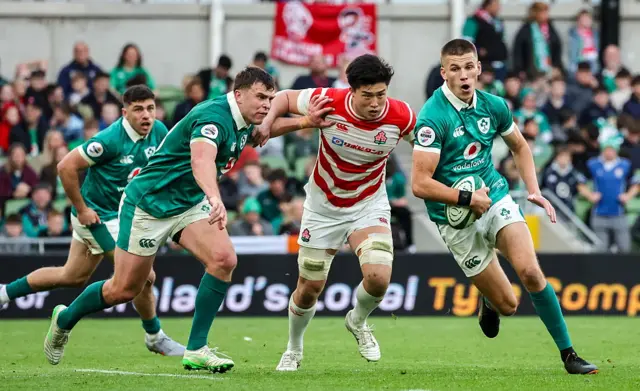 Sam Prendergast runs with the ball against Japan