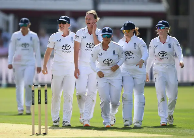 Lauren Filer and England celebrate the wicket of Richa Ghosh