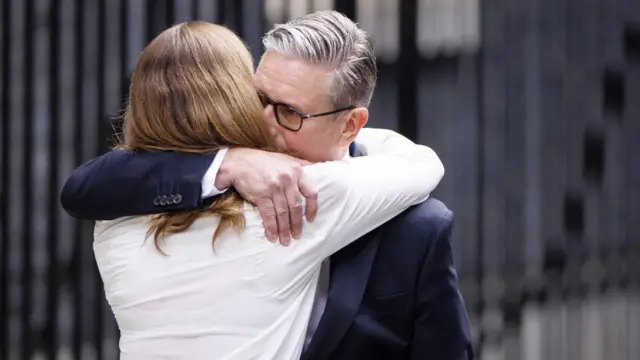 Keir Starmer is shown hugging his wife Victoria after making his resignation statement in Downing Street