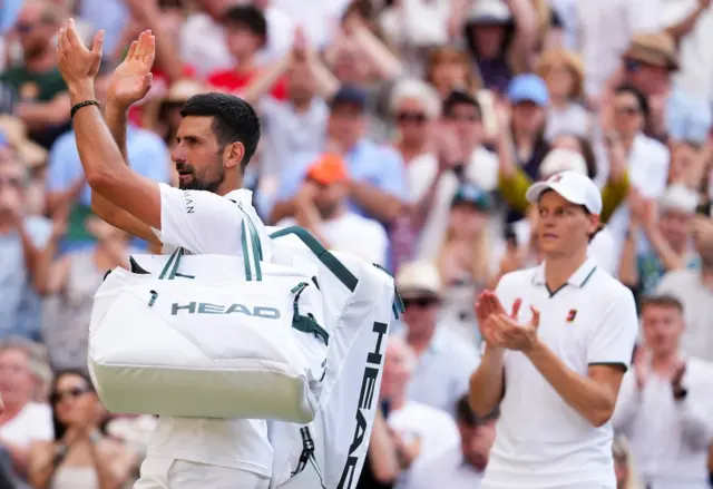 Novak Djokovic applauds the crowd