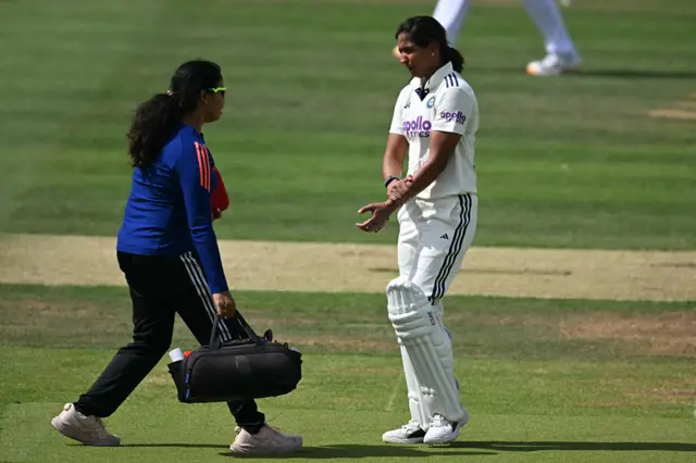 Harmanpreet Kaur receives treatment on a left arm