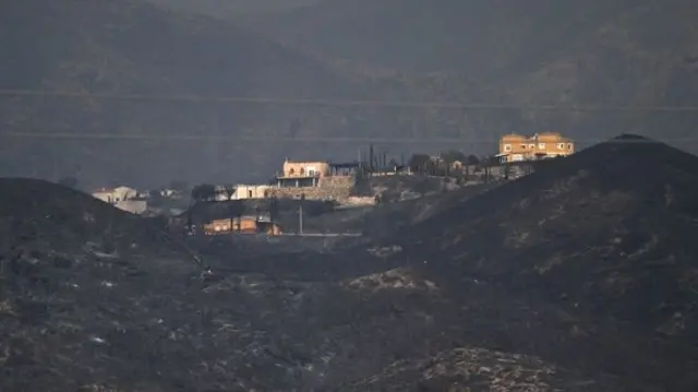 The village of Bedar photographed from an aerial view around charred hills