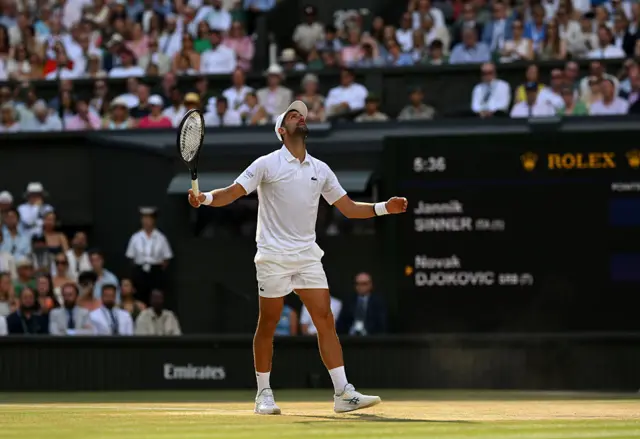 Novak Djokovic looks to the skies