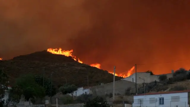 Smoke and flames rise during a wildfire in Los Gallardos