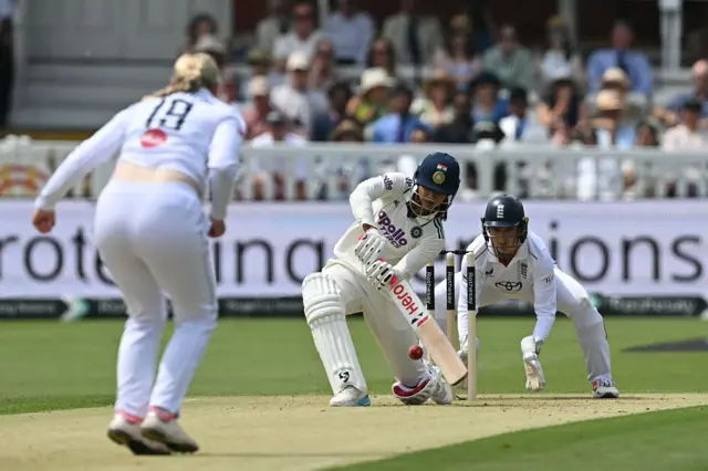Smriti Mandhana hits a shot against Sophie Ecclestone