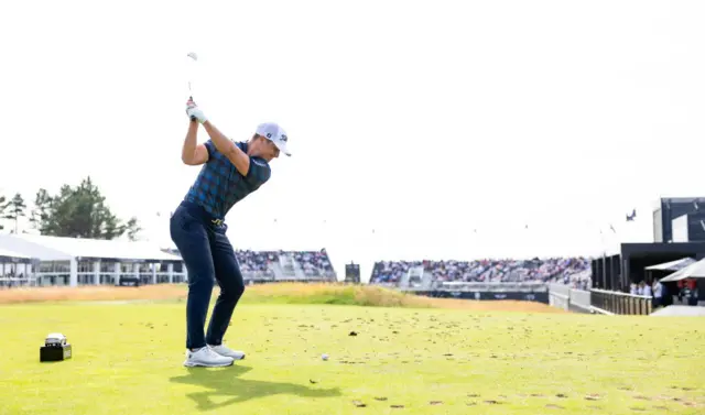 Calum Hill in action yesterday at the par-three 15th