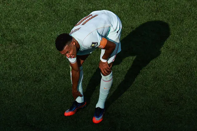 Kylian Mbappe feels his ankle before being subbed off
