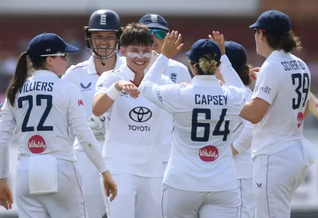 Issy Wong celebrates the wicket of Smriti Mandhana
