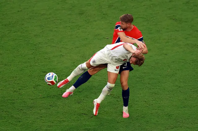 Harry Kane #9 of England competes for the ball against Kristoffer Ajer
