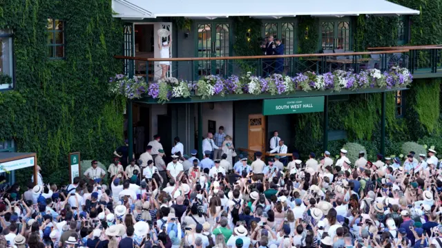 Linda Noskova parades the Wimbledon trophy