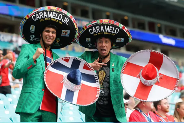 Mexican fans Hector Chavez Caramelo and son gesture in the stands