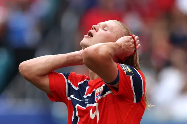 Erling Haaland #9 of Norway ties his hair