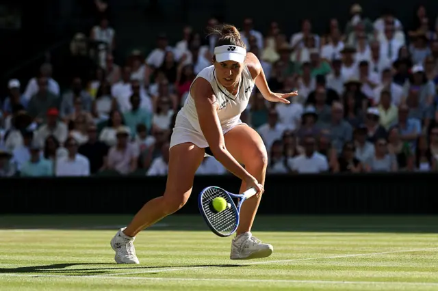 Linda Noskova hits a forehand