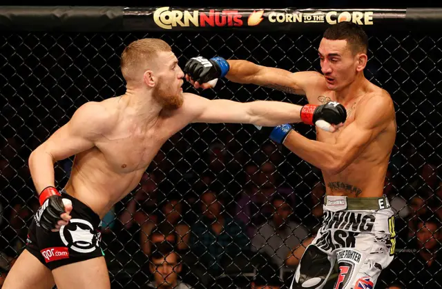Conor McGregor punching Max Holloway
