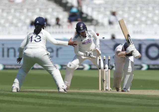 England's Mady Villiers is bowled out by India's Sneh Rana during day two of the first Women's Rothesay Test at Lord's Cricket Ground