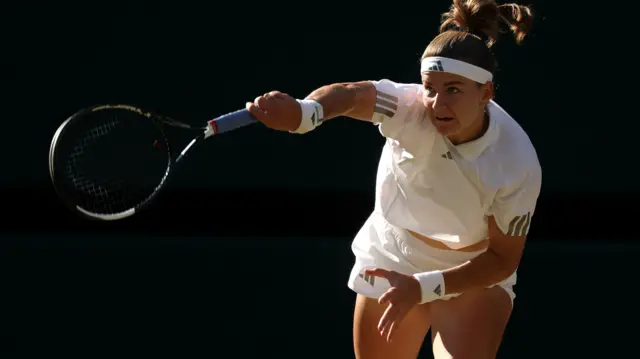 Karolina Muchova serves