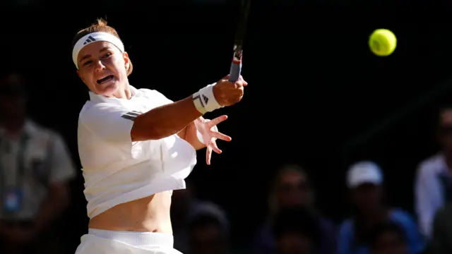 Karolina Muchova hits a forehand