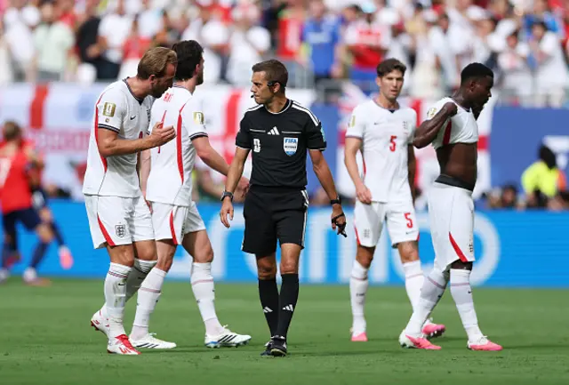 Harry Kane #9 of England argues with referee Clement Turpin
