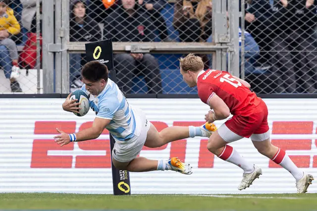 Justo Piccardo of Argentina dives to score a try