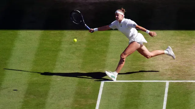 Karolina Muchova returns serve