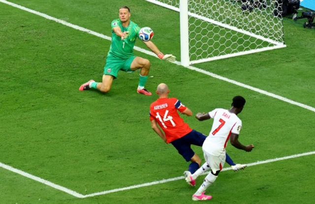 Norway's Orjan Nyland makes a save from England's Bukayo Saka