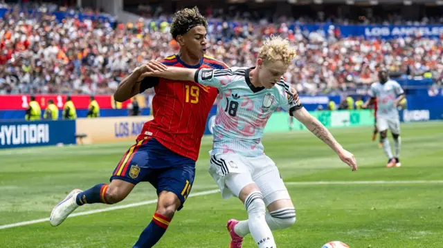 Lamine Yamal #19 of Spain battles Joaquin Seys #18 of Belgium during the Spain v Belgium: Quarterfinal - FIFA World Cup 2026 at Los Angeles Stadium on July 10, 2026 in Inglewood, Californi