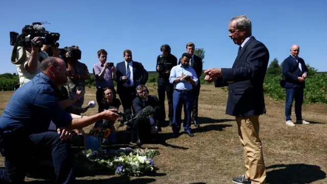 Nigel Farage speaks to members of the press after laying flowers at Dartmoor National Park in tribute to Ann Widdecombe