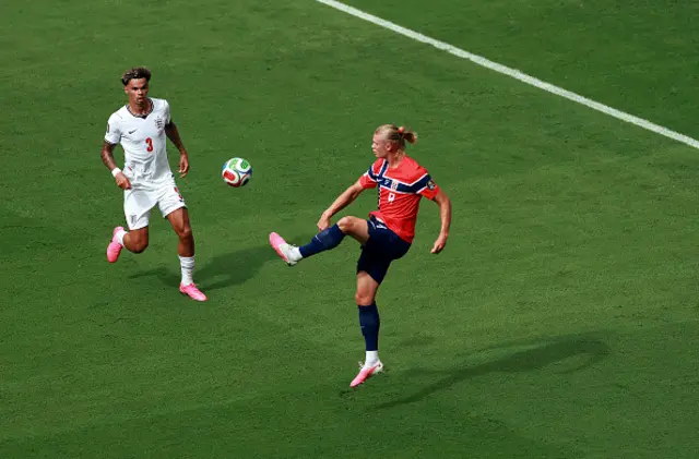 Erling Haaland #9 of Norway controls the ball against Nico O'Reilly
